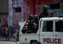 Police patrol the Champ de Mars area of Port-au-Prince, Haiti (Ramon Espinosa/AP)
