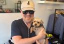 Ricky Gervais cuddles rescue dog Charley at the Hampstead All Dogs Matter pop-up shop
