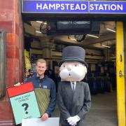 John Keen-Tomlinson, custom games executive at Winning Moves UK, with the Monopoly man at the launch of the Hampstead and Highgate Monopoly edition outside Hampstead station