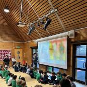Older student Ewan delivers an assembly to pre-prep children at St Anthony's