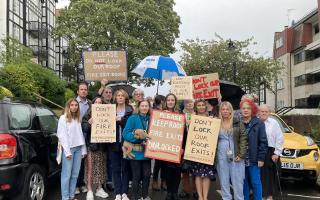 Holly Lodge community at an earlier protest against fire exit closures in September. Now some say a new fire alarm system is too sensitive.