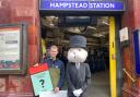 John Keen-Tomlinson, custom games executive at Winning Moves UK, with the Monopoly man at Hampstead Station