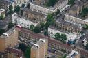 An aerial view of terraced housing and blocks of flats in London