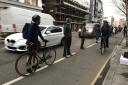 Campaigners - pictured during a 'human bike lane' protest earlier this year - have long said the Old Street corridor is too dangerous for cyclists. It is hoped the new measures will address this. Picture: Tabitha Tanqueray