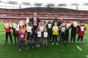 Per Mertesacker helping raise awareness for World Down Syndrome Day with young Gunners fans. Credit Arsenal FC