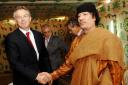 Former Prime Minister Tony Blair meeting the then Libyan leader Colonel Muammar Gaddafi. Picture: PA