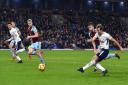 Tottenham Hotspur's Harry Kane (right) scores his side's third goal of the game during the Premier League match at Burnley (pic: Anthony Devlin/PA Images).