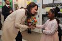 The Duchess of Cambridge receives flowers from six-year-old Nevaeh during her visit to Hornsey Road Children's Centre in Holloway. Picture: Richard Pohle/The Times/PA Wire