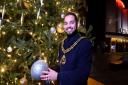Mayor of Haringey Cllr Adam Jogee with the Muswell Hill Christmas Tree sponsored by traders from Muswell Business and local donors. Picture: Polly Hancock