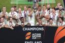 England's Owen Farrell (centre) lifts the Autumn Nations Trophy after victory in the final against France at Twickenham Stadium