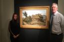 From Dickinson, specialist James Roundell and managing director Emma Ward with Van Gogh�s Peasant Woman in front of a Farmhouse. Picture: Martin Bailey