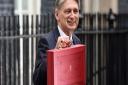Chancellor Philip Hammond holding his red ministerial box outside 11 Downing Street before heading to the House of Commons to deliver his budget. Picture: Joe Giddens/PA Wire