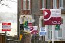 Sold, To Let and Let By estate agent signs placed outside