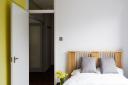 The bedroom follows the simple and functional modernist style