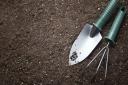 Photo of gardening tools lying in some soil. PA Photo/thinkstockphotos
