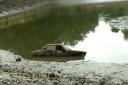 The mysterious car found at the bottom of the Model Boating Pond in Hampstead Heath. Picture: Florence Bridge
