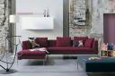 Dark red corner sofa from B&B Italia with polished chrome legs
