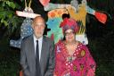 Professor Peter Fonagy OBE, chief executive of the Anna Freud Centre, and Camila Batmanghelidjh CBE, founder of Kids Company, sit on a  bench in the Freud Museum garde, which was decorated by primary school-aged Kids Company children