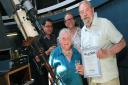 Doug and Julia Daniels were honoured at the Hampstead Observatory for their sterling efforts as volunteers for a combined 104 years. They were handed an award by Sky at Night presenter Dr Paul Abel (back left) and impressionist and amateur astronomer Jon 