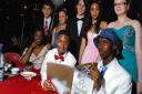 Acland Burghley School held a Bugsy Malone-themed prom for GCSE students. (Back row, from left) Tony Lysandrides, Faye Perkins, Conor Clark, Keyanne Mohammed-Appadoo, Katie Bolger, and (front row, from back) Rachel Somoye, Emil Sengati and Libaan Hassan. 
