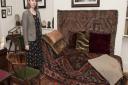 Freud Musuem development director Marion Stone with the psychoanalyst's famous couch. Picture: Nigel Sutton
