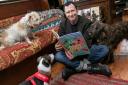 Lonely Planet UK head, Tom Hall, held the 'canine reading' to celebrate World Book Day