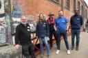 (L-R) Martin Sach, London Canal Museum with the Canal & River Trust's Ros Daniels, Phil Emery, Alex Patterson, and Spencer Green on the newly repaired 'Dead Dog Bridge'