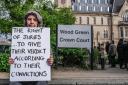 A Highgate XR campaigner calling for jury rights outside Wood Green Crown Court