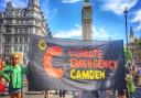 Climate emergency banner at parliament during a coalition march on July 23