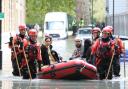 A family being rescued from the floods in Clapton on Wednesday morning. Picture: Paul Wood