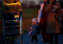 A young girl from Ukraine walks with her family as they cross the border point from Ukraine into Medyka, Poland