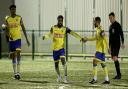 David Olufemi of Haringey Borough scores the first goal for his team and celebrates with his team mates