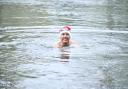 Dr Jon Goldin taking a Christmas dip in Hampstead's Men's Pond