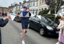 Jamie Austin finishes his 220-mile run in Brent Cross on Saturday (February 4)