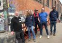 (L-R) Martin Sach, London Canal Museum with the Canal & River Trust's Ros Daniels, Phil Emery, Alex Patterson, and Spencer Green on the newly repaired 'Dead Dog Bridge'