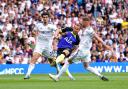 Tottenham's Harry Kane fires goalwards against Leeds