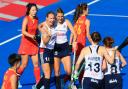 Sarah Robertson celebrates scoring for Great Britain against China