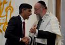 Prime Minister Rishi Sunak (left) and Chief Rabbi Sir Ephraim Mirvis attending Finchley United Synagogue yesterday (October 9)