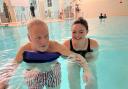 'Unsung Hero' Megan Allen helping swimmer John at the Park Road Pool in Crouch End