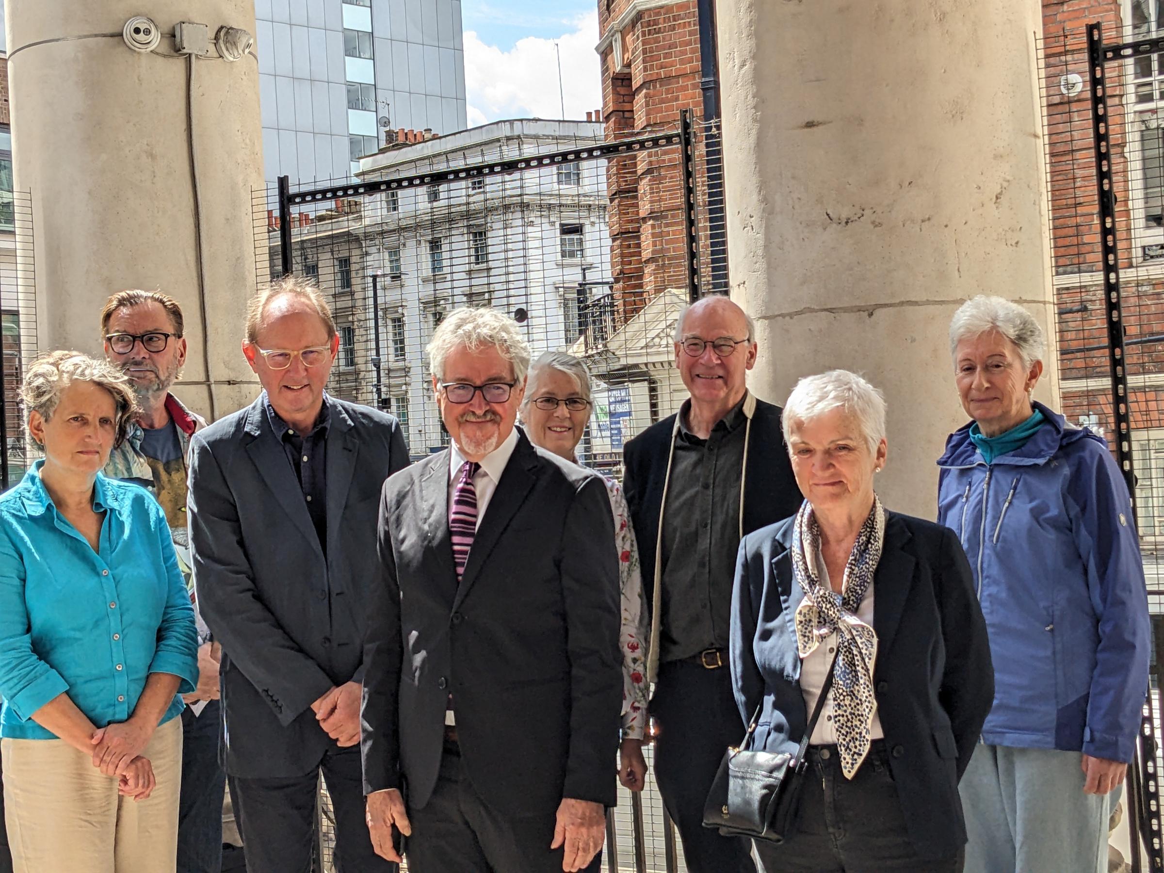 Griff Rhys Jones with Save Museum Street Coalition at St Georges Bloomsbury with view of tower block which could be demolished behind them. Photo: Julia Gregory