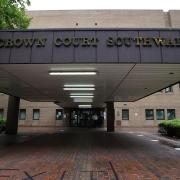 Sevendefendants accused of bribery appeared at Southwark Crown Court by video-link