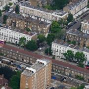 An aerial view of terraced housing and blocks of flats in London