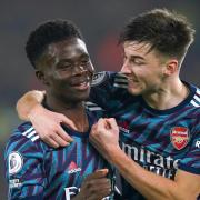 Arsenal's Bukayo Saka (left) celebrates with team-mate Kieran Tierney after scoring their side's third goal of the game at Elland Road