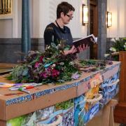 Coffin Club director and independent celebrant Jane Morgan with a hand decorated cardboard coffin