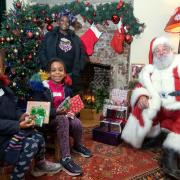 At Lauderdale House - Eve (7), Helena (5) and mum Andrea Bara-Bara meet Father Christmas