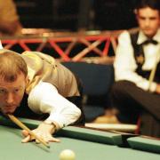 Former world snooker champion Steve Davis, of England takes his next shot as he partners Alex Lely (pictured) during their victory over USA