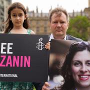 Richard Ratcliffe and his daughter Gabriella holding signs in Parliament Square in September to mark the 2,000th day Nazanin Zaghari-Ratcliffe has been detained in Iran.