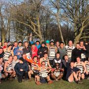 Highgate Harriers men celebrate their Met League title double in 2020, with captain Rob Wilson (front row, centre) leading the cheers