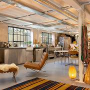 Contemporary industrial interiors in the penthouse, which is above the building's offices