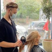 Elivinas Piscikas with one of the first customers at ELK Hair + Beauty in Belsize Park